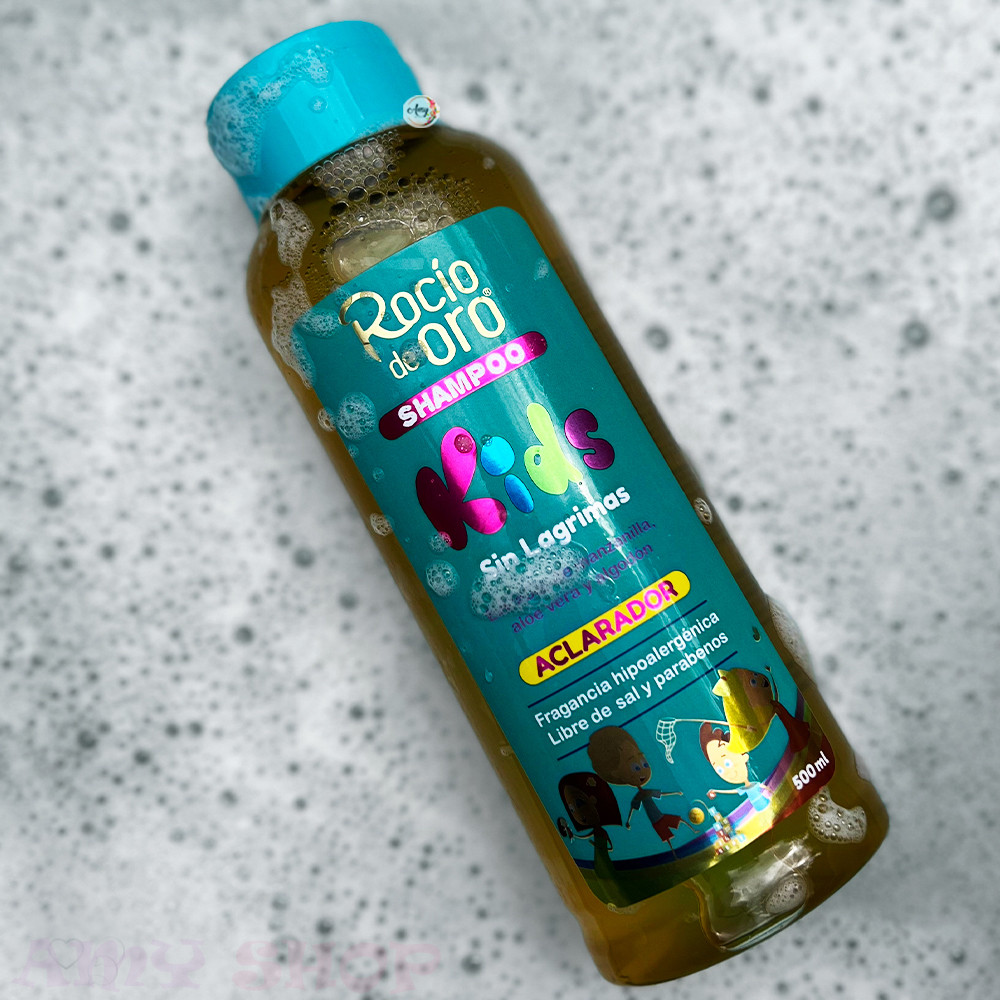 Shampoo Rocío Kids Sin Lágrimas 500ml en botella con tapa azul, rodeado de espuma.