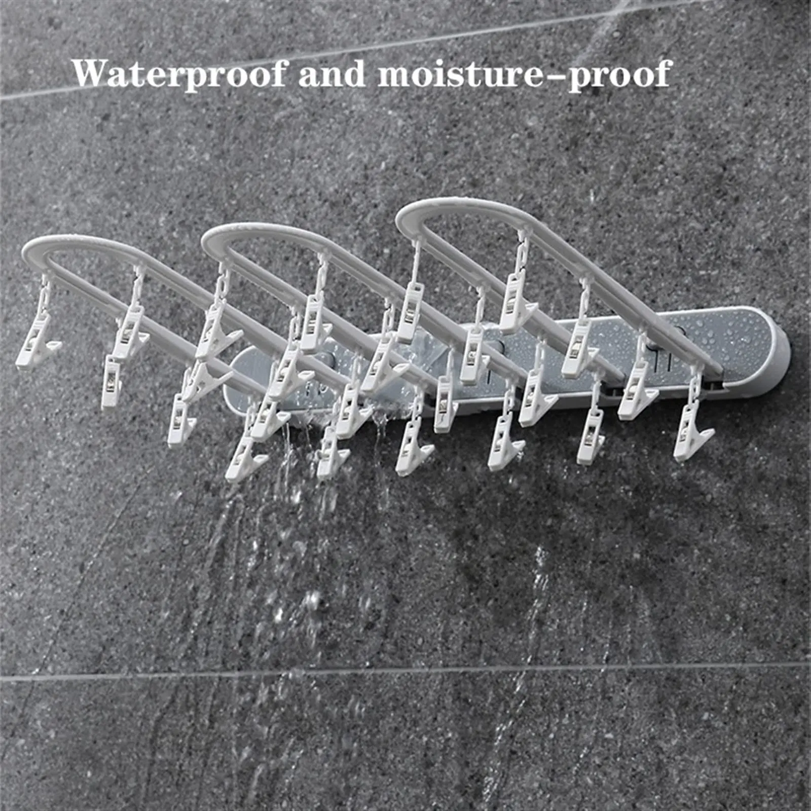 Tendedero plegable gris con 20 clips para ropa, resistente al agua, ideal para baños.
