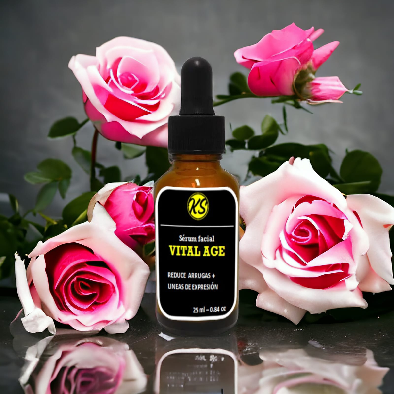 Serum facial Vital Age con gotas, rodeado de rosas rosadas y blancas, reflejándose en superficie oscura.