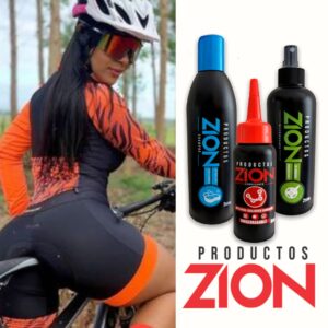 Mujer ciclista con ropa deportiva naranja y negra, junto a kit de limpieza y lubricación Zion para bicicletas, 300ml y 250ml.