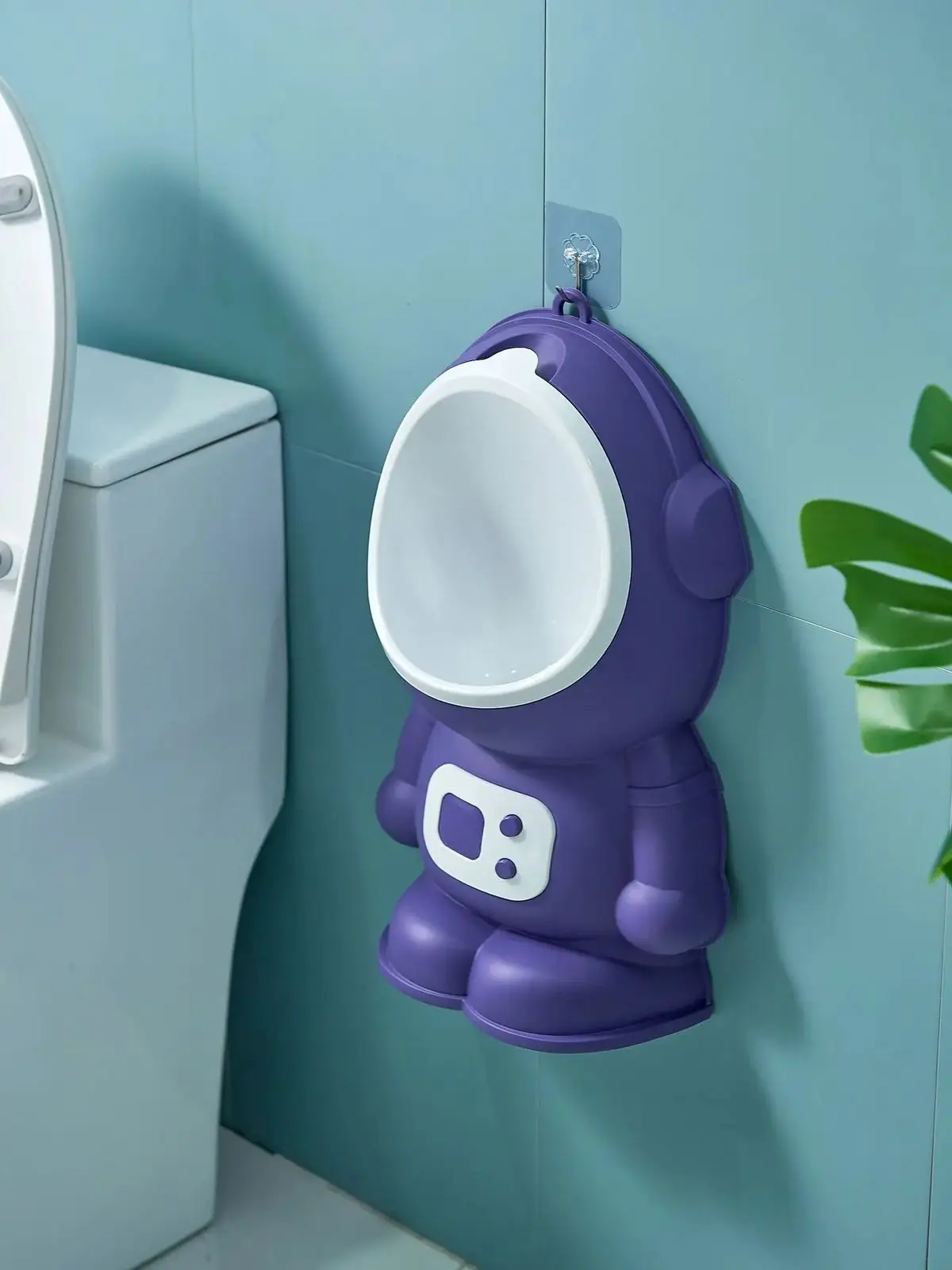 Orinal infantil morado diseño astronauta, se cuelga en pared, ideal para entrenamiento de baño.
