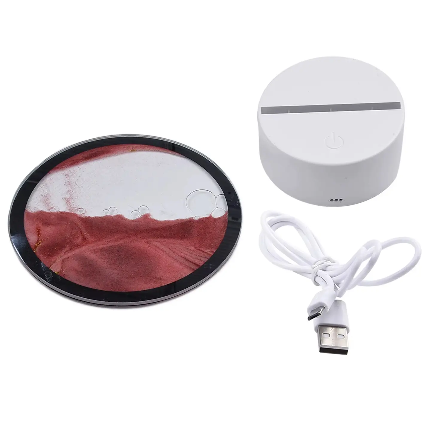 Lámpara RGB táctil con arena movediza roja y base blanca, incluye cable USB.