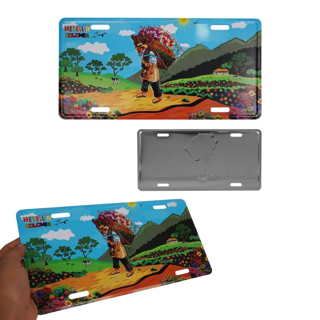 Set x2 placa metálica decorativa Medellín Colombia, hombre cargando flores, paisaje rural colorido, 30x15 cm.