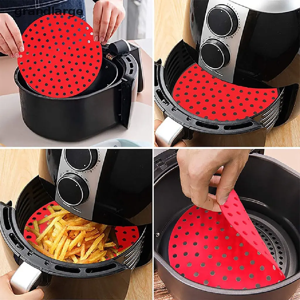 Protector de silicona rojo redondo con perforaciones para freidora de aire, usado para evitar residuos y facilitar la limpieza de la cesta.