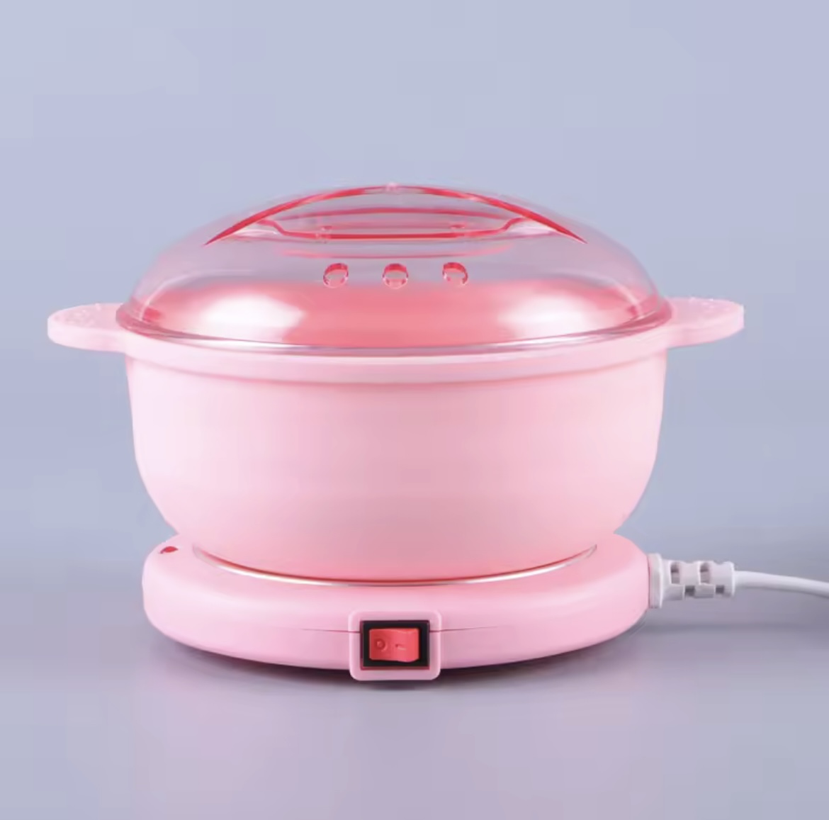 Olla rosada calentadora de cera depilatoria con tapa transparente y control de encendido.