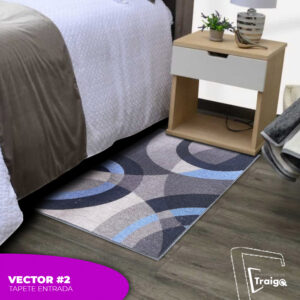 Tapete de entrada gris y azul con diseño geométrico moderno al lado de cama y mesa de noche.