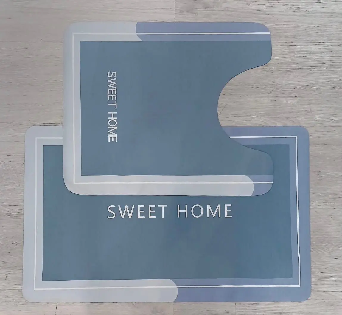 Tapetes Duo Absorbente, azul, con diseño moderno y texto "SWEET HOME", ideal para baño.