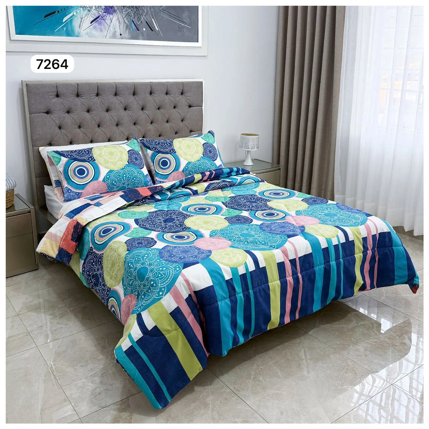 Cubrelecho doble faz para cama doble con estampado geométrico y círculos en tonos azules, verdes y rosas.