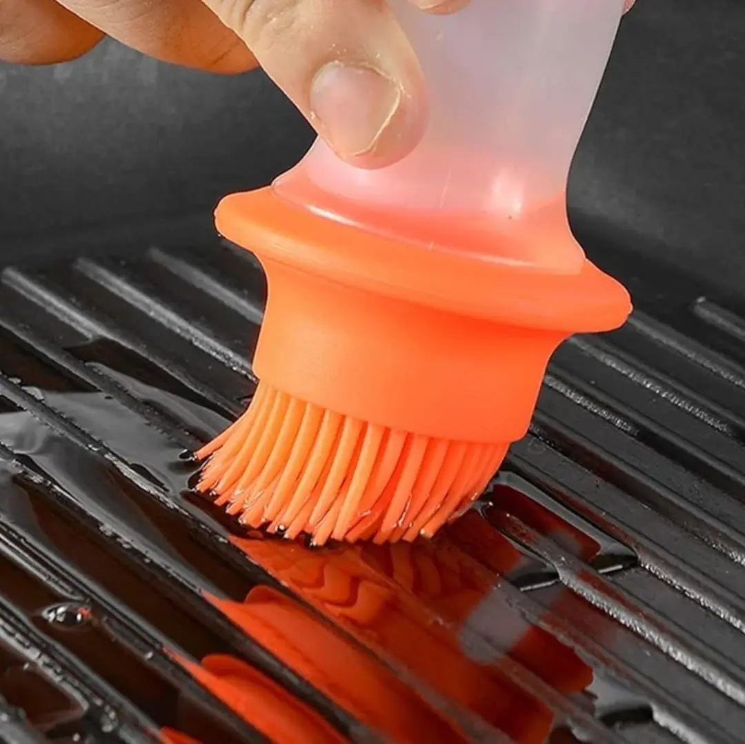 Brocha de silicona naranja para dispensar aceite en parrilla, parte de un set x2.