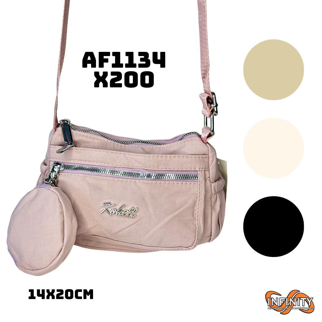 Bolso cruzado rosa pálido Kohell 14x20cm, con monedero colgante y cremalleras plateadas.