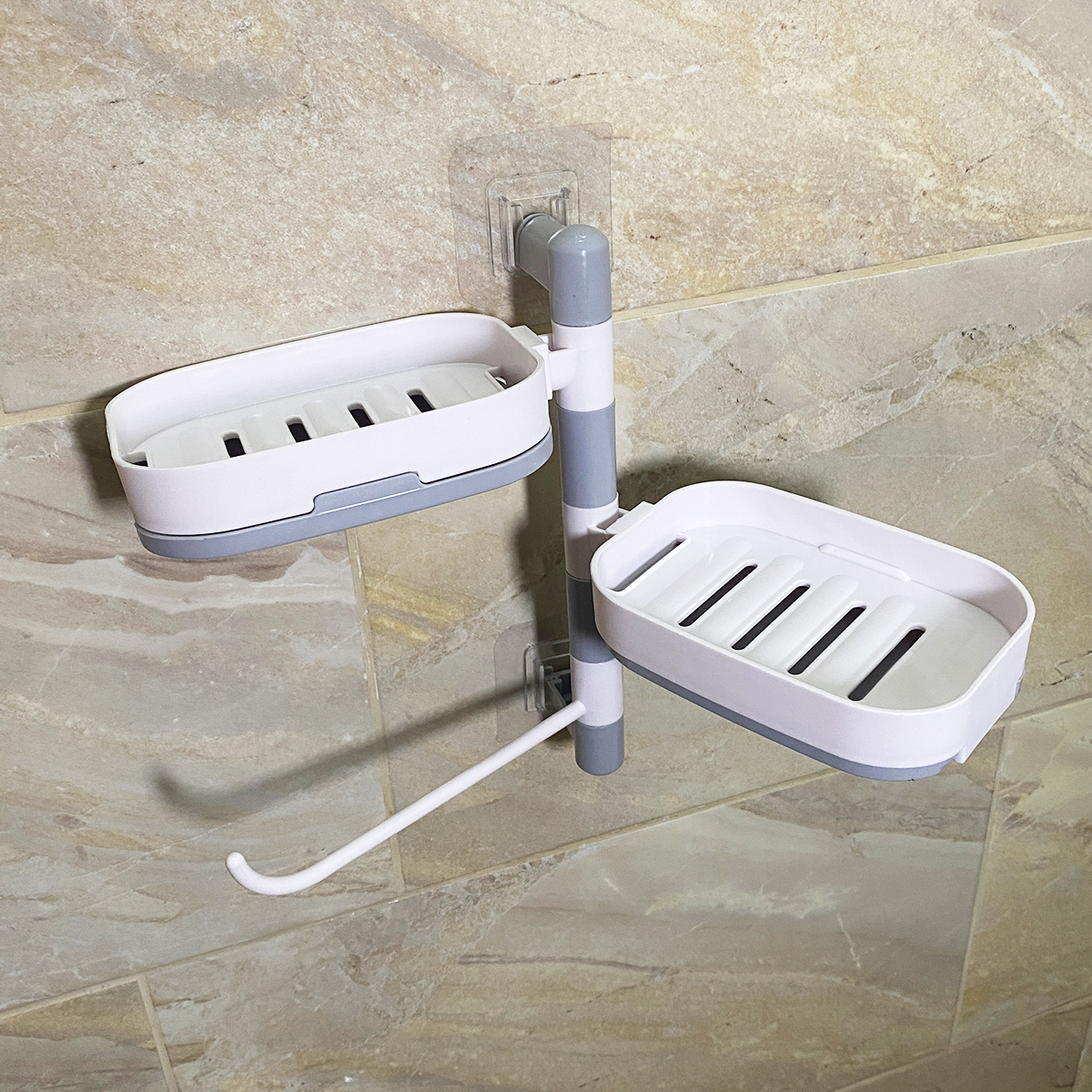 Jabonera doble de pared giratoria en blanco y gris, con drenaje y gancho, ideal para baño.