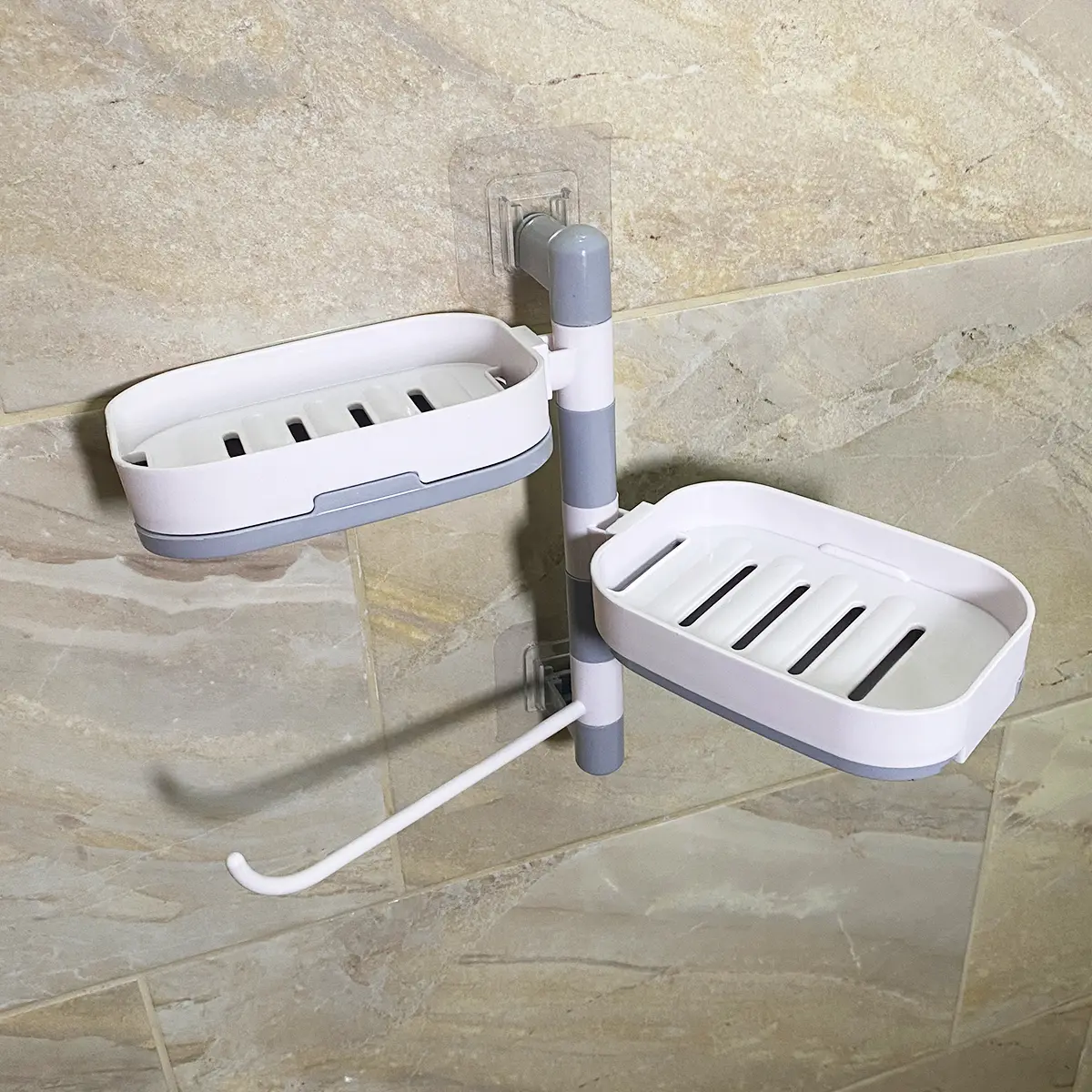 Jabonera doble de pared giratoria en blanco y gris, con drenaje y gancho, ideal para baño.