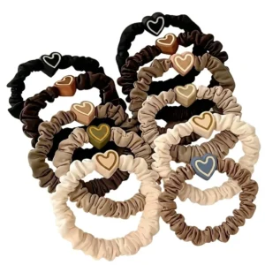 Ligas para cabello con diseño de corazón en tonos tierra y pastel, pack de 10 unidades.