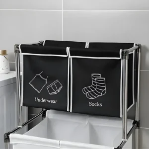 Cesta para ropa sucia negra de 2 divisiones, "Underwear" y "Socks", con estructura metálica.