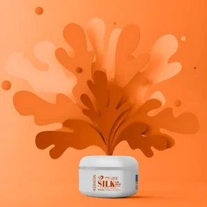 Crema para cabello con gusano de seda y queratina, en envase blanco, con fondo naranja y diseño abstracto.
