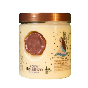 Mascarilla capilar reparadora Origen Botánico en pote, color crema, con grabado estilo sello y diseño de hada.