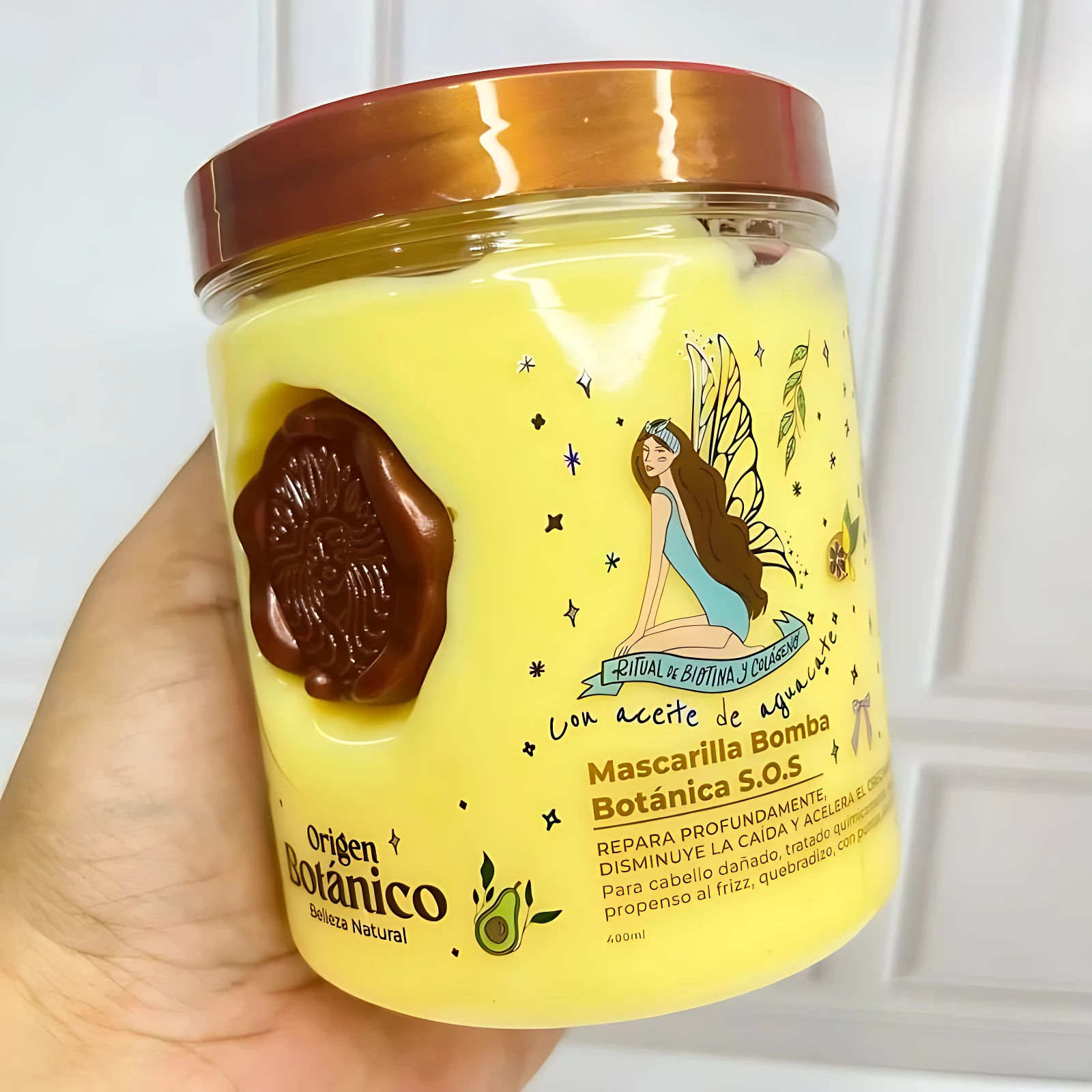 Mascarilla capilar reparadora Bomba S.O.S Origen Botánico, amarilla, con hada y aguacate. 400ml.