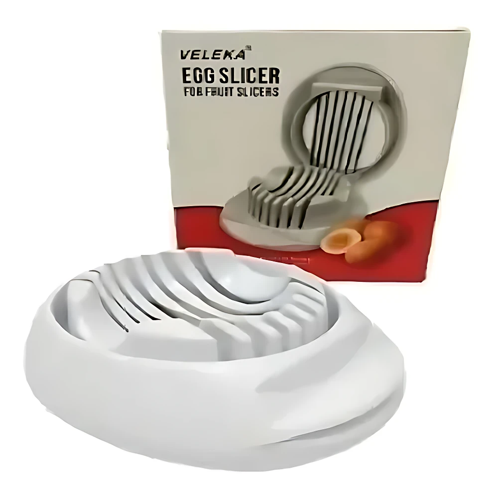 Rebanador de huevos blanco VELEKA para desayunos y ensaladas, con caja y dos mitades de huevo visible.